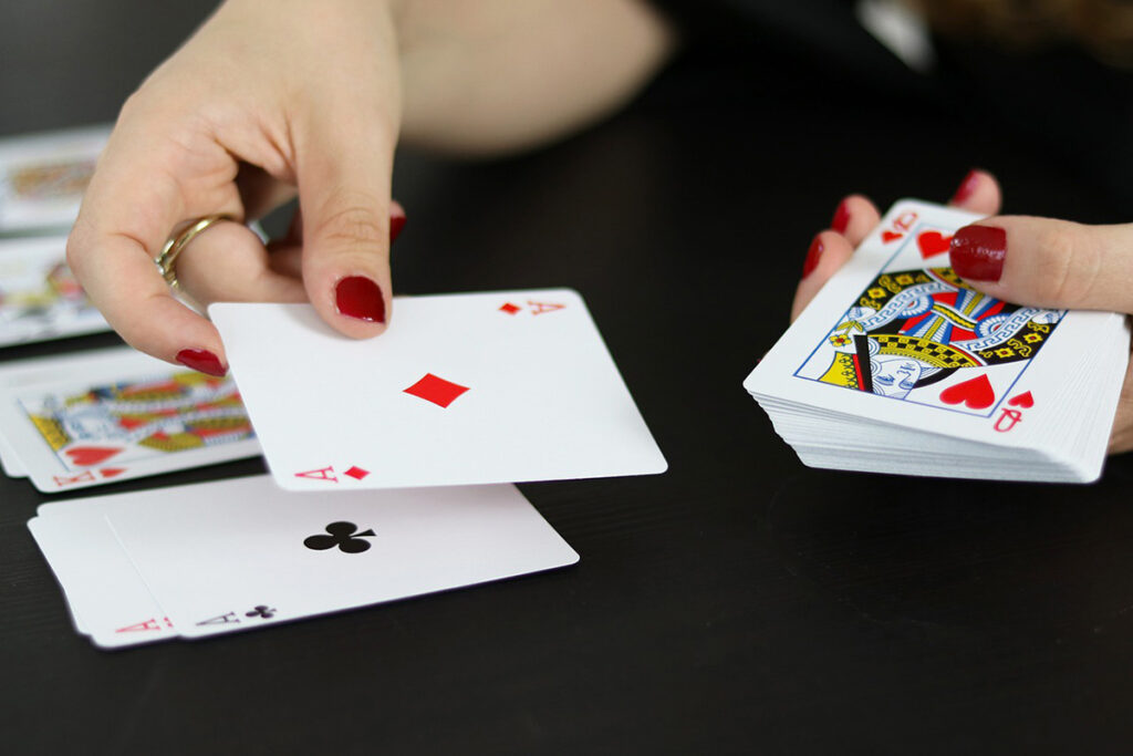 woman plays card game